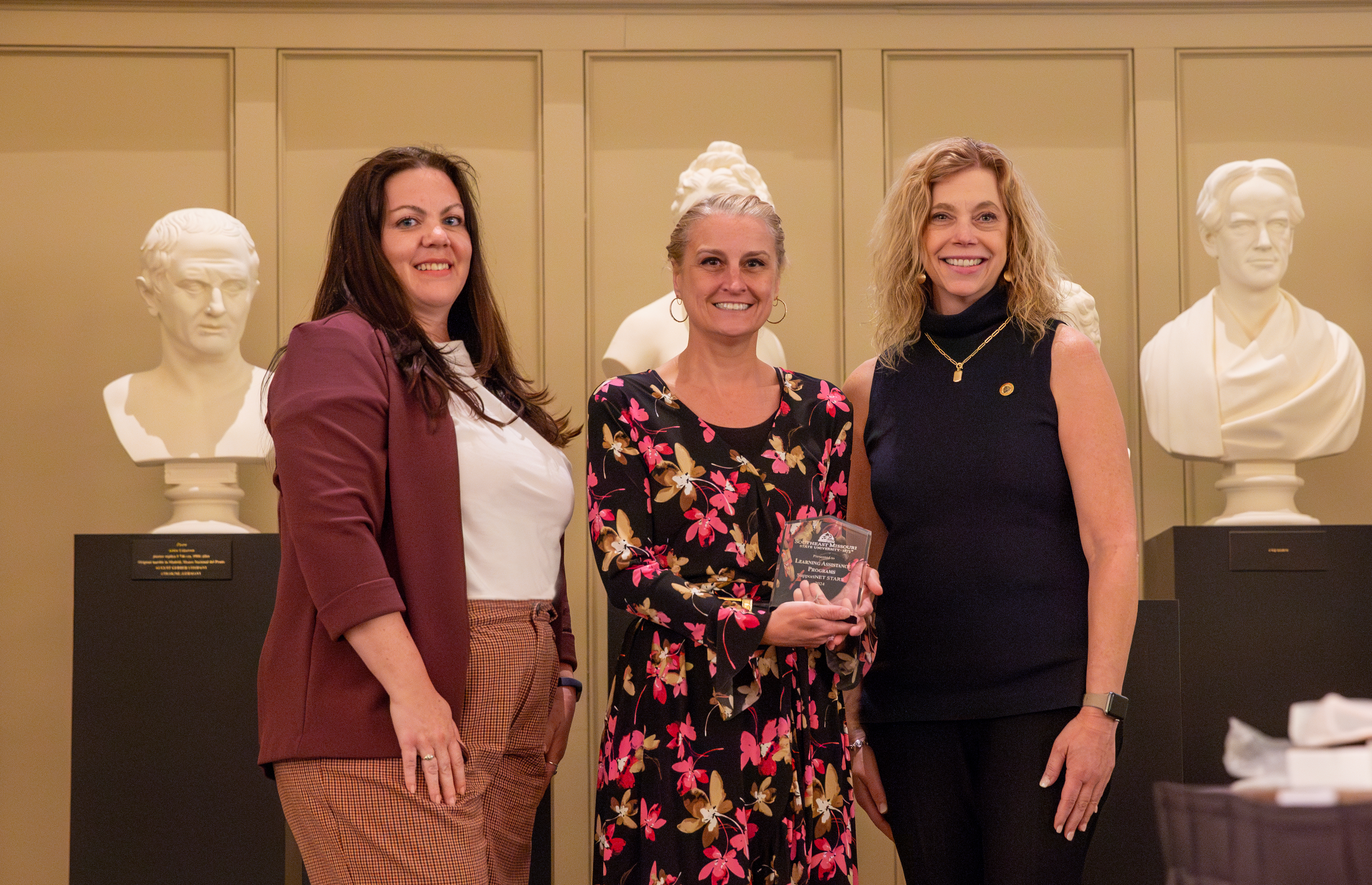 The Learning Assistance Programs team receives their student success award.