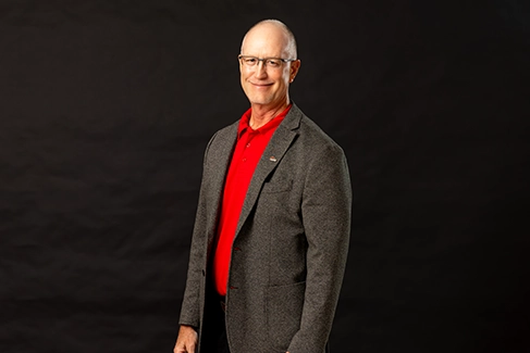 A professional headshot of Larry Christopher Decker.