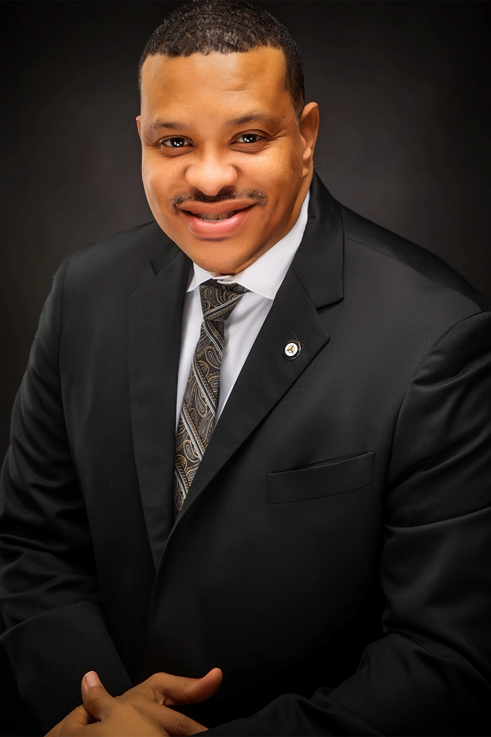 A professional headshot of Dr. Corey Bradford.