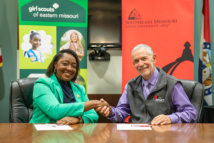 SEMO president Dr. Carlos Vargas shakes hands with Girl Scouts of Eastern Missouri CEO Natissia Small. 