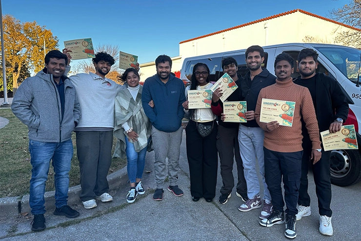 Hackathon students pose with their winning certificates.