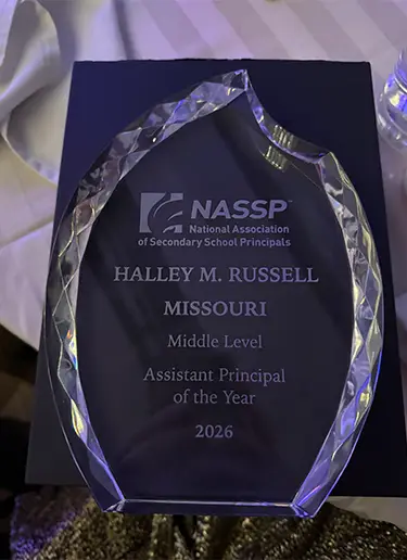 A photo of Halley Russell's Middle Level Assistant Principal of the Year award.