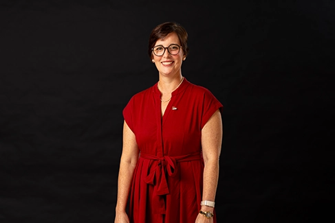 A professional headshot of Kelly Zigaitis.