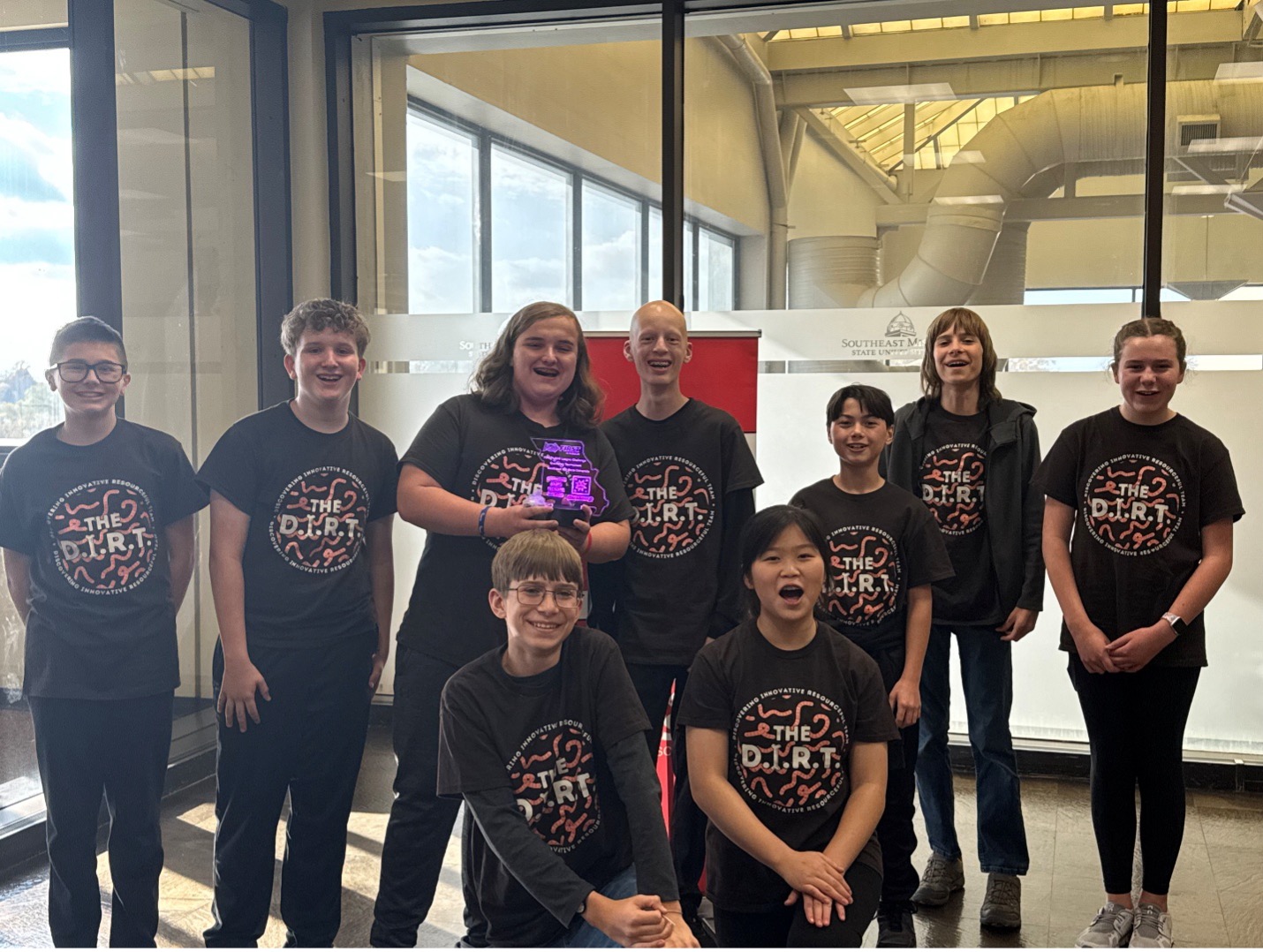 The D.I.R.T. team from Jackson, MO posing with their Champion's Award at SEMO's LEGO League Challenge.