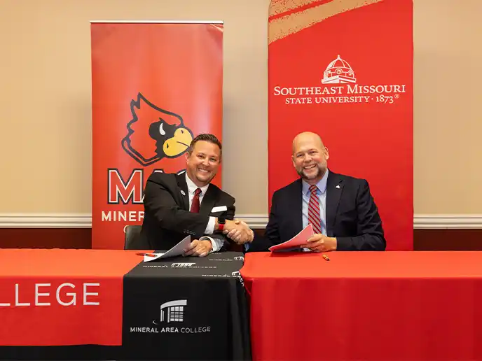 Mac and SEMO univeristy President sign partnership to bring students to a higher level of eduction after high school