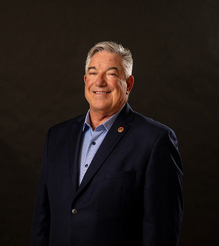 Professional portrai of Lewis Miltenberger, attorney, and SEMO Alumni in front of a black background.