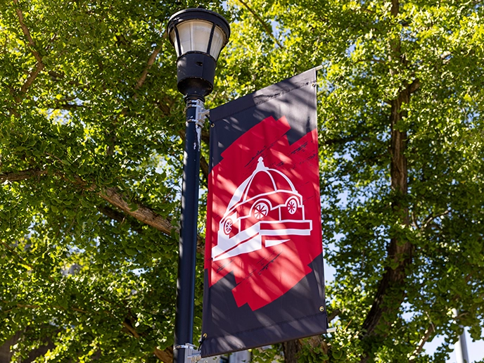 A photo of a SEMO banner with the dome in white on a red and black background.