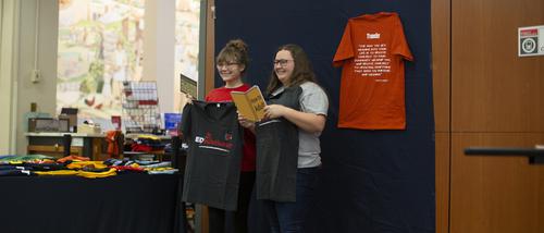 Two students pose together with Southeast t-shirts at the transfer student booth.