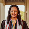 Image of Ayshia graduating Semo in her cap and gown.