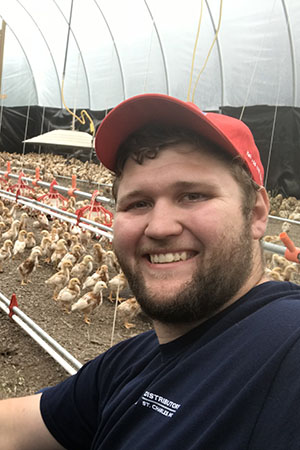 Christopher Ludwig with chickens