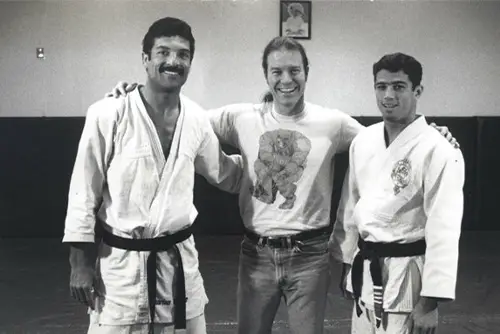 Sam Park with friends wearing martial arts outfits at SEMO