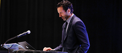 George Couros talking on a stage.