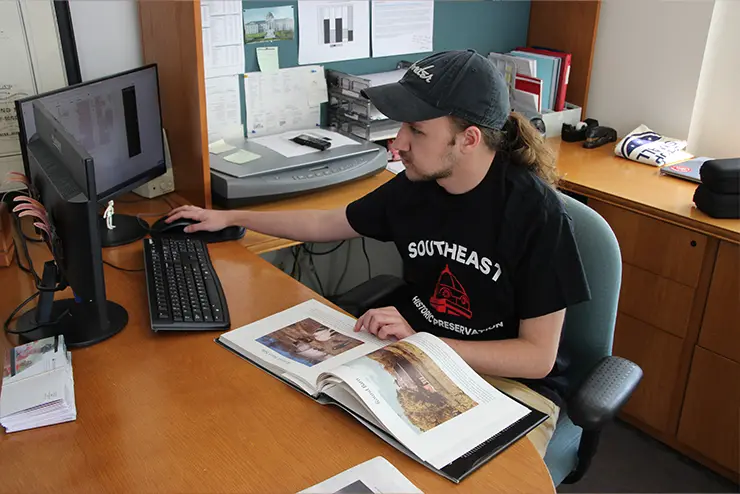 Student at the Center for Regional History working on QWERTY keyboard 