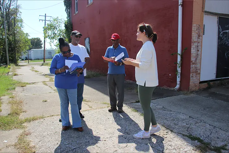 Student from the Center for Regional History with Cape Girardeau residents who are sharing oral history of the Haarig district