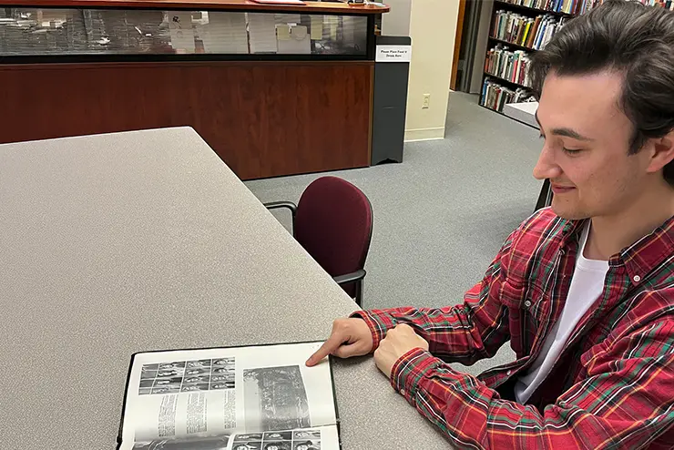 Historical Preservation Student reading a historical document 