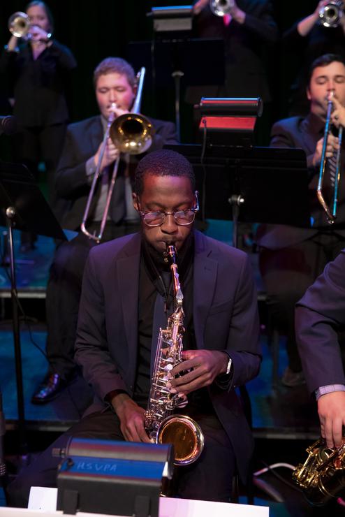 The saxophone player in the jazz band performing at the Bedell Performance Hall at the River Campus. 
