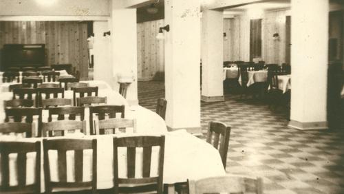 Tables and chairs set up for dinner inside Cheney Hall