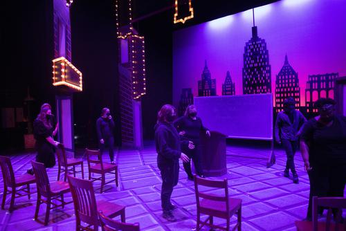 students working on placing set pieces in lighting used for production