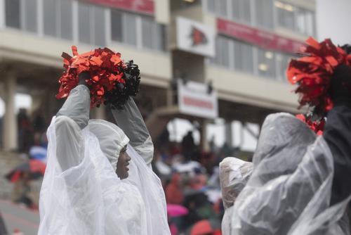 Cheerleader cheering in the rain