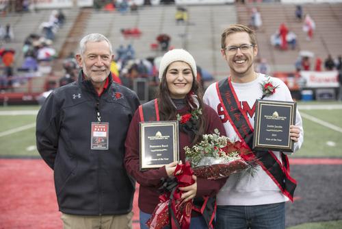 Man and Women of the Year standing next to the President smiling