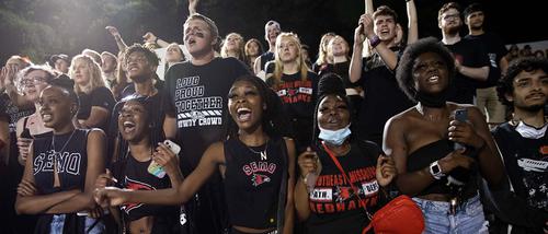 students section at the football game cheering