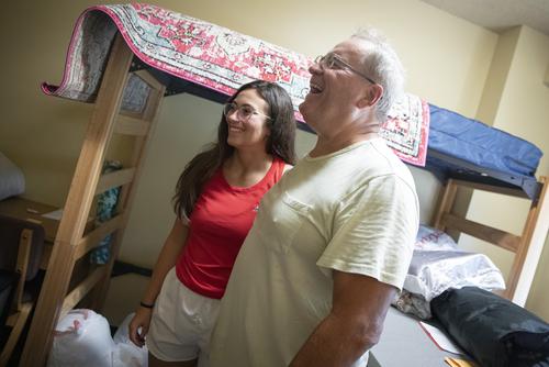 Katie Williams taking a photo with her dad on move-in day in her dorm
