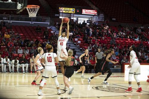 A SEMO basketball player dunks.