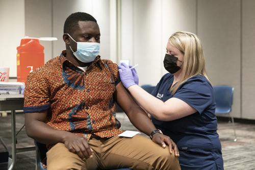 A man gets a Covid-19 shot