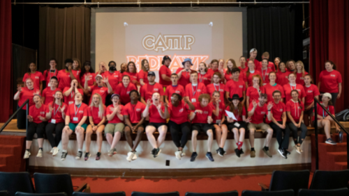 CampRedhawk students take a group photo on the stage in Academic Hall.