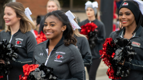 Southeast cheerleaders walk in the Homecoming Parade.