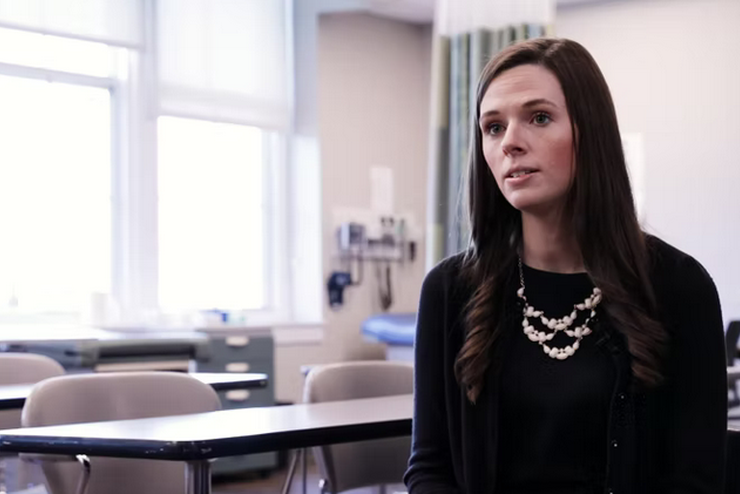 Nursing Alum Molly Eggleston sits in the Nursing Lab at Crisp Hall.