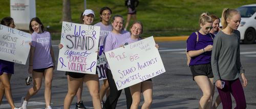 Greek students participate in the Walk A Mile event.