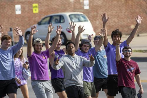 Fraternity and Sorority Life students participate in the Walk a Mile in Her Shoes event.