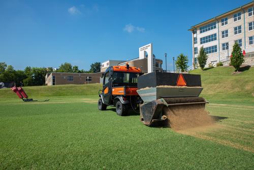 Facilities Management getting the practice football field ready