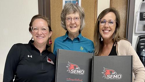 Lenell Hahn poses with teachers