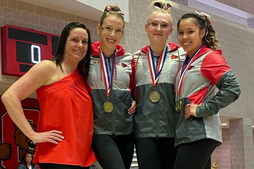 Anna Kaziska, Lindsay Ockler, and Jolie MIller standing with their medals on