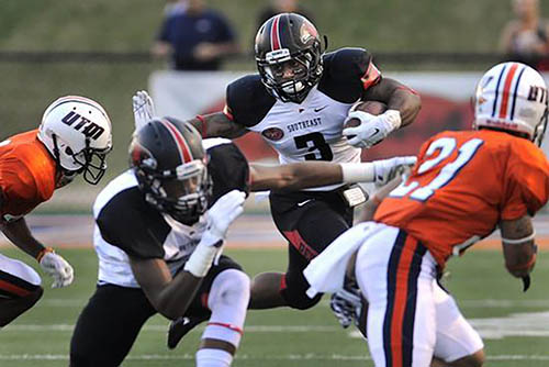 lennies in his Southeast football uniform playing in a game against another team