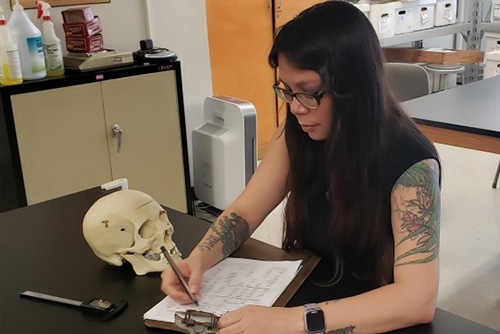 Professor looking at bones