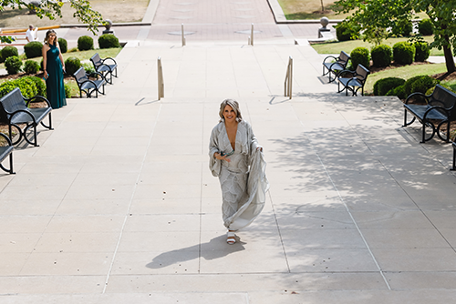 Katie walking up the stairs of Academic