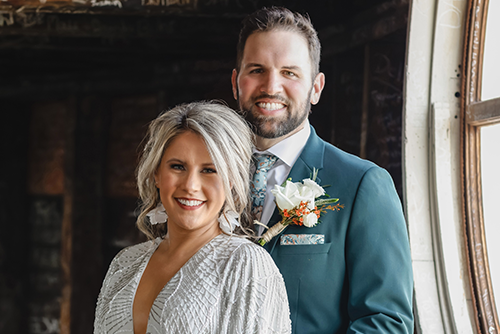 Katie and Matt Smiling at the Camera in the dome
