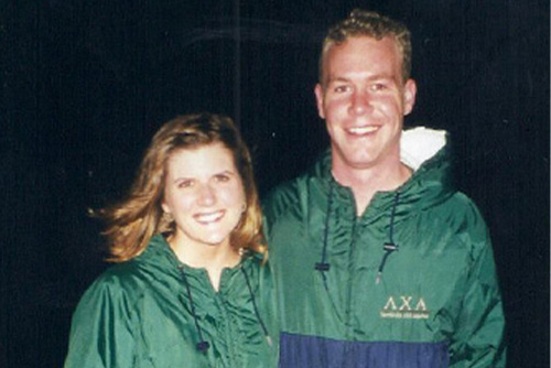 Emily and D.J. wearing their green pullovers to support their Greek organizations