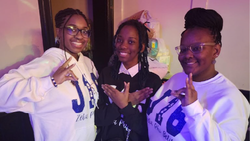 Zeta members pose for a photo in their blue and white colors.
