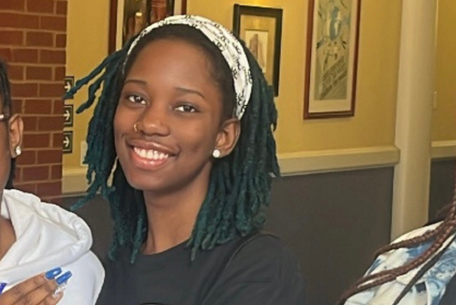 Kayla Powell smiles at a Zeta event with her sorors.