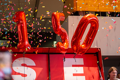The 150 numbers in balloons floating in the air