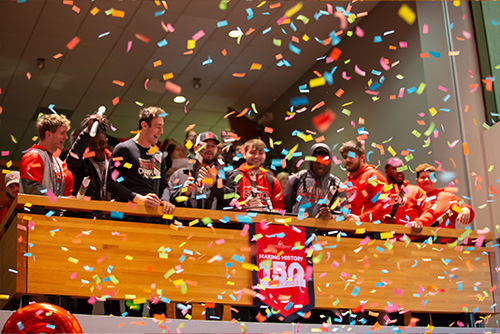 Football players shot off confetti cannons at the 150 celebration