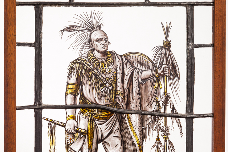 An illustration of a Native American chief on a window pane.