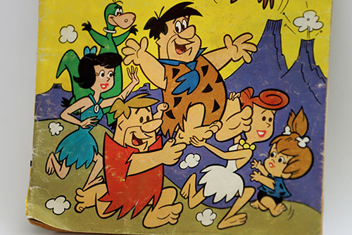 A cartoon family with dinosaurs runs happily