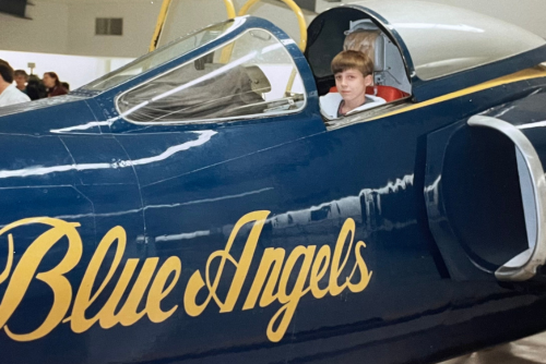 Young Bryce Aubuchon sits inside a Blue Angels jet decades before becoming part of the flight squad.