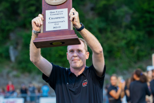 Brady Barke holds up Commissioners Cup trophy.