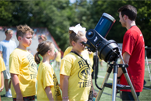 A local Cape Girardeau student looks through a telescope during activities at the 2017 total solar eclipse. Local students will once again congregate at Southeast Missouri State University for the 2024 total solar eclipse